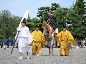 Priests and shrine wardens lead horses and palanquins through northern Kyoto